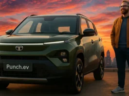 Tata Punch EV electric SUV in Empowered Oxide Dual Tone parked on an urban road at dusk with LED headlights and city skyline.